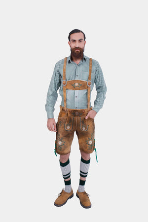 Man wearing traditional Lederhosen with green checkered shirt, brown leather suspenders featuring Edelweiss flower embroidery, named 'Christoph Waltz Suspender.