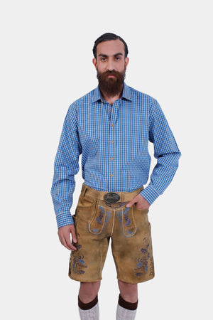 Close-up of the side pocket on Daniel Brühl Lederhosen showing intricate embroidery and a knife pocket.