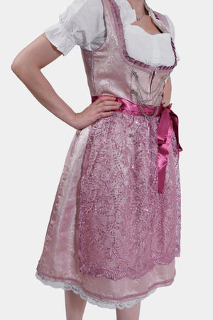 Another Side view of the dirndl dress highlighting the pink lace apron, satin ribbon belt, and detailed floral patterns on the fabric.