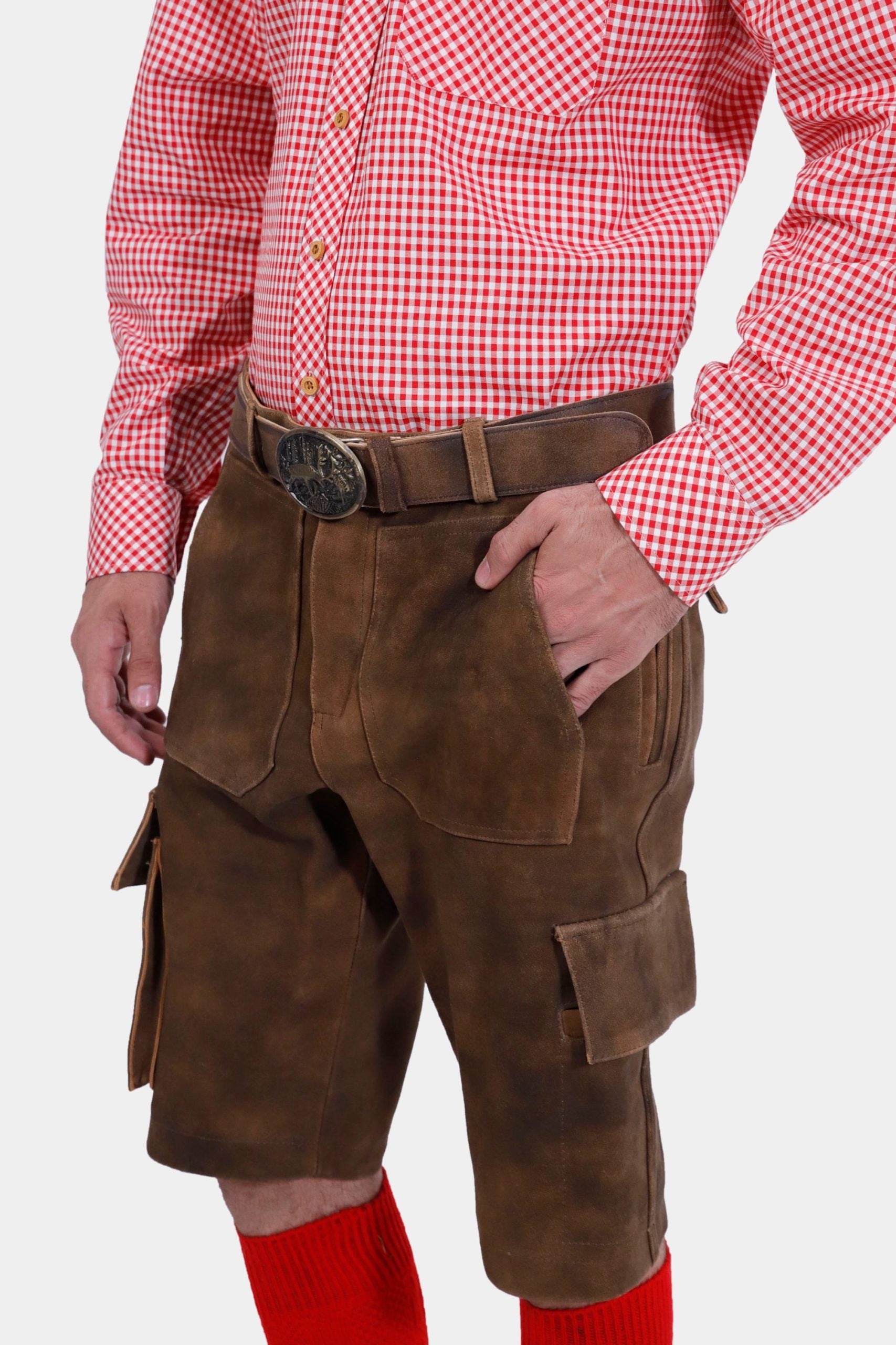 Another side view of the man in brown leather lederhosen, focusing on the side pockets and the belt.