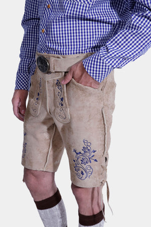 Man in light beige lederhosen with blue embroidery, front and back pockets, and a side knife pocket