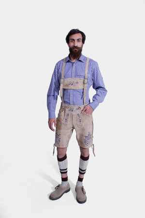 Man in light beige lederhosen with blue embroidery, front and back pockets, and a side knife pocket