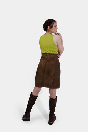 Back view of women wearing Gastein Lederhosen Skirt in Desert Amber, goat suede leather, knee-length design, tailored fit. Belt not included