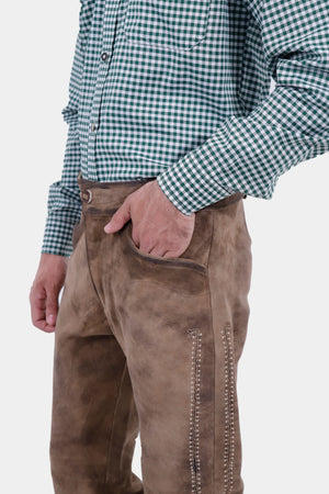 Closed side view of a man wearing Helsinki Long Lederhosen