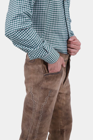Closed side view of a man wearing Helsinki Long Lederhosen