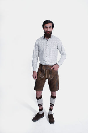 Lechfall Legend Lederhosen in Rustic Mahogany, knee-length goat suede leather with natural embroidery, brown horn buttons, and multiple practical pockets.