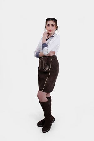 Rear view of the Lillian Lederhosen Skirt showing the back design and fit, worn with a white blouse.