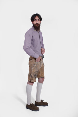 Complete Side View of a man wearing Short Traditional Lederhosen