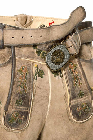 Close-up of lederhosen shorts men detailing intricate embroidery on the front pockets, highlighting the classic German craftsmanship and vintage leather texture.