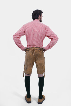 Rear view of a man wearing Oktoberfest Tulsa Lederhosen and dark green socks, showcasing the detailed embroidery on the back of the shorts.