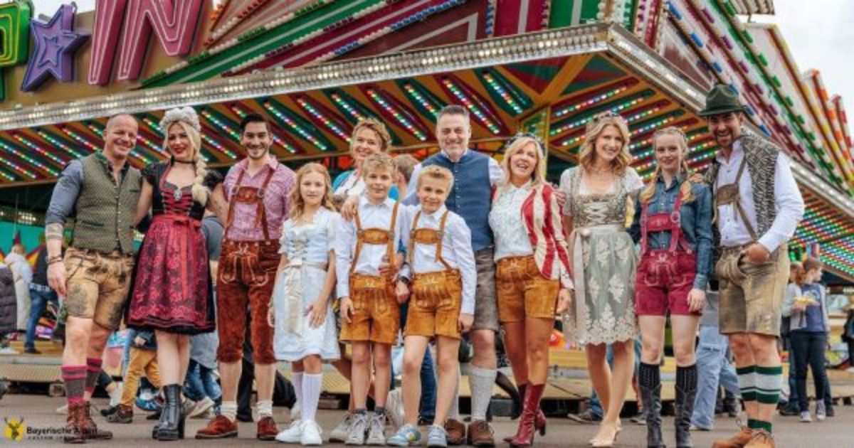 Happy Group in Traditional Bavarian Lederhosen and Dirndls at Oktoberfest