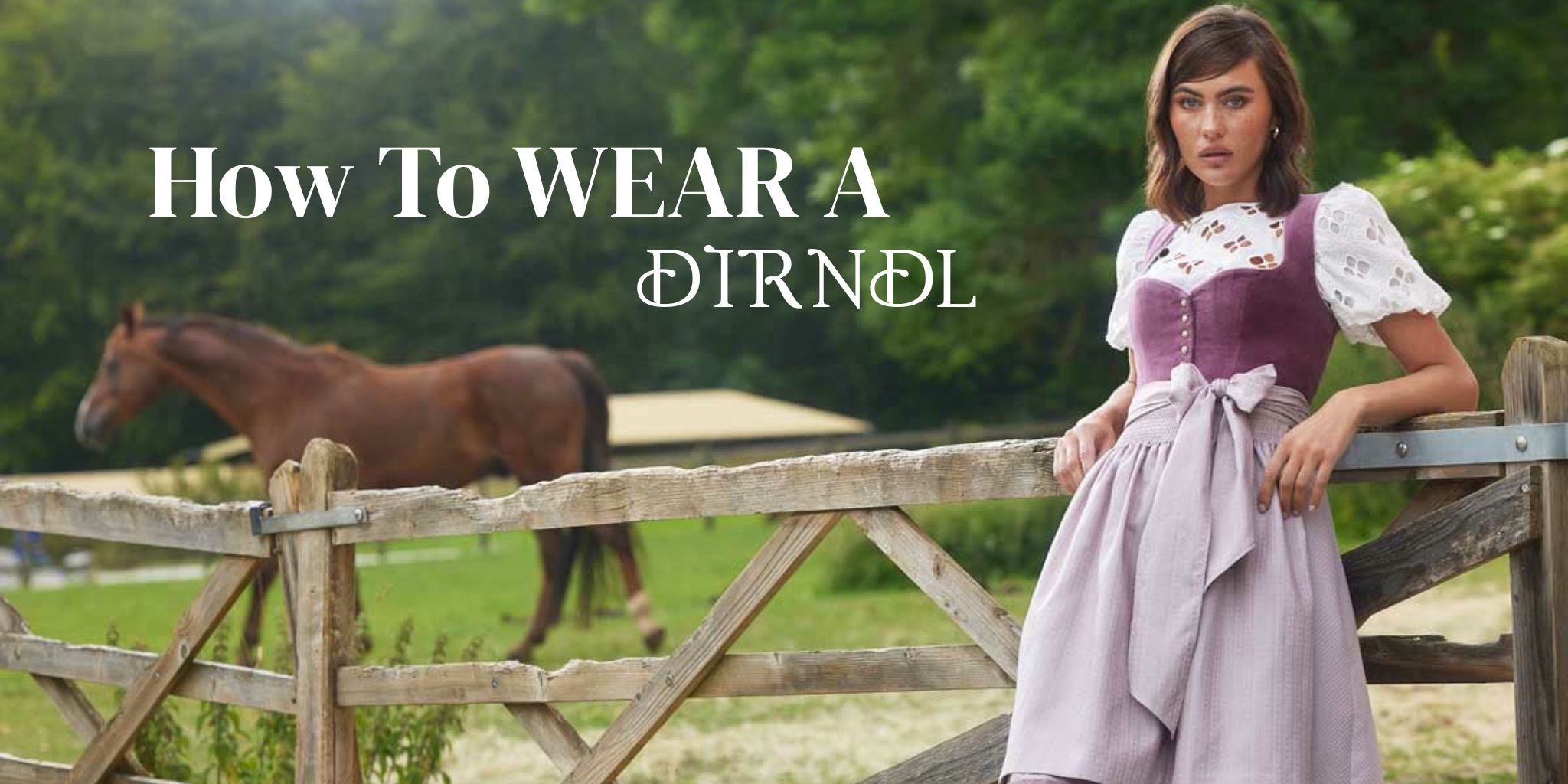 Woman wearing a traditional Bavarian dirndl dress in a countryside setting with a horse in the background