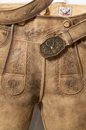A close-up of German lederhosen shorts showcasing fine craftsmanship, including a decorative belt buckle and detailed stitchwork. These lederhosen short shorts are designed for durability and style during Oktoberfest events