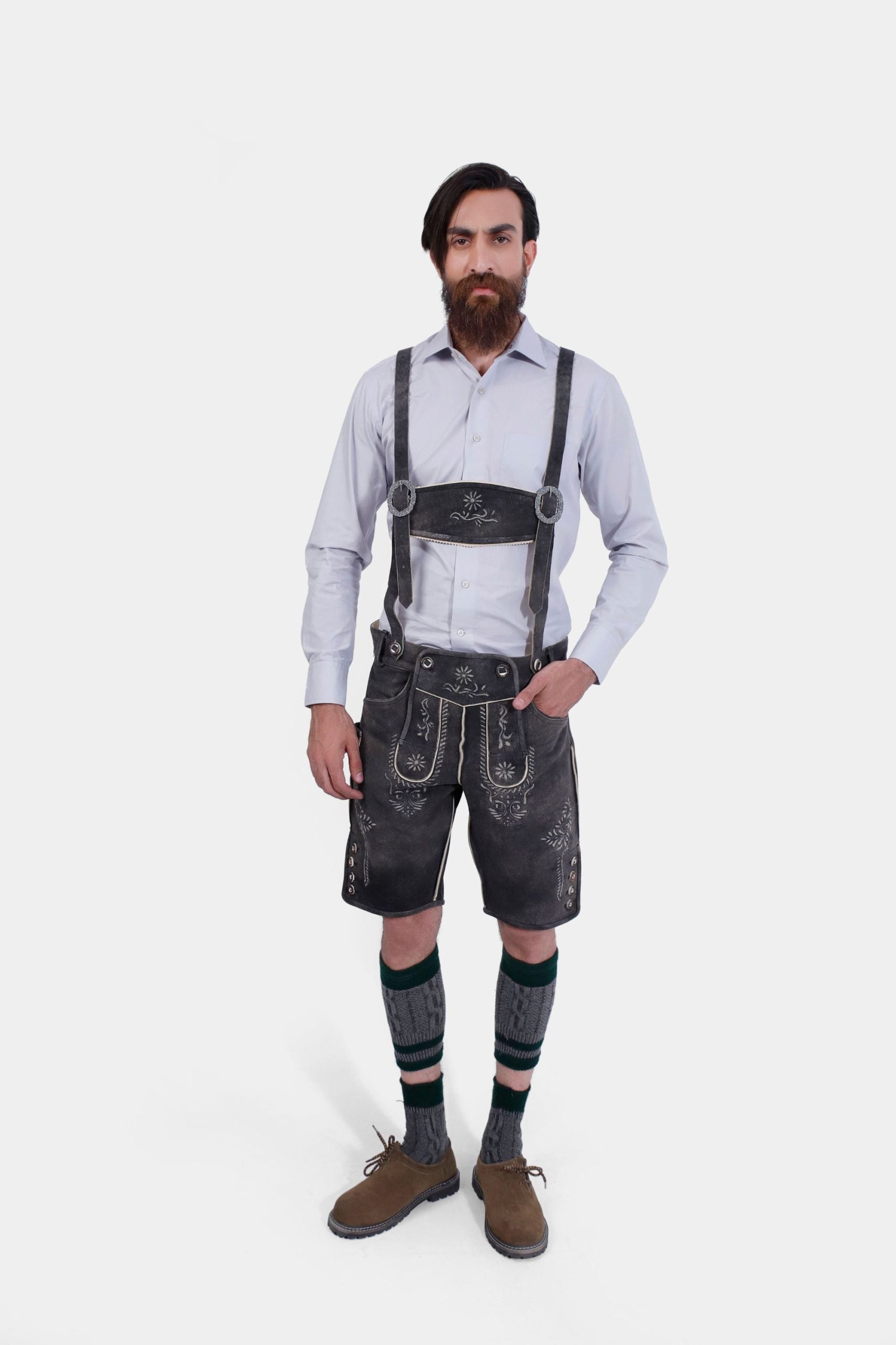 Full front view of the man in Black Forest Lederhosen, exuding a classic Bavarian look with knee-high socks and brown shoes.