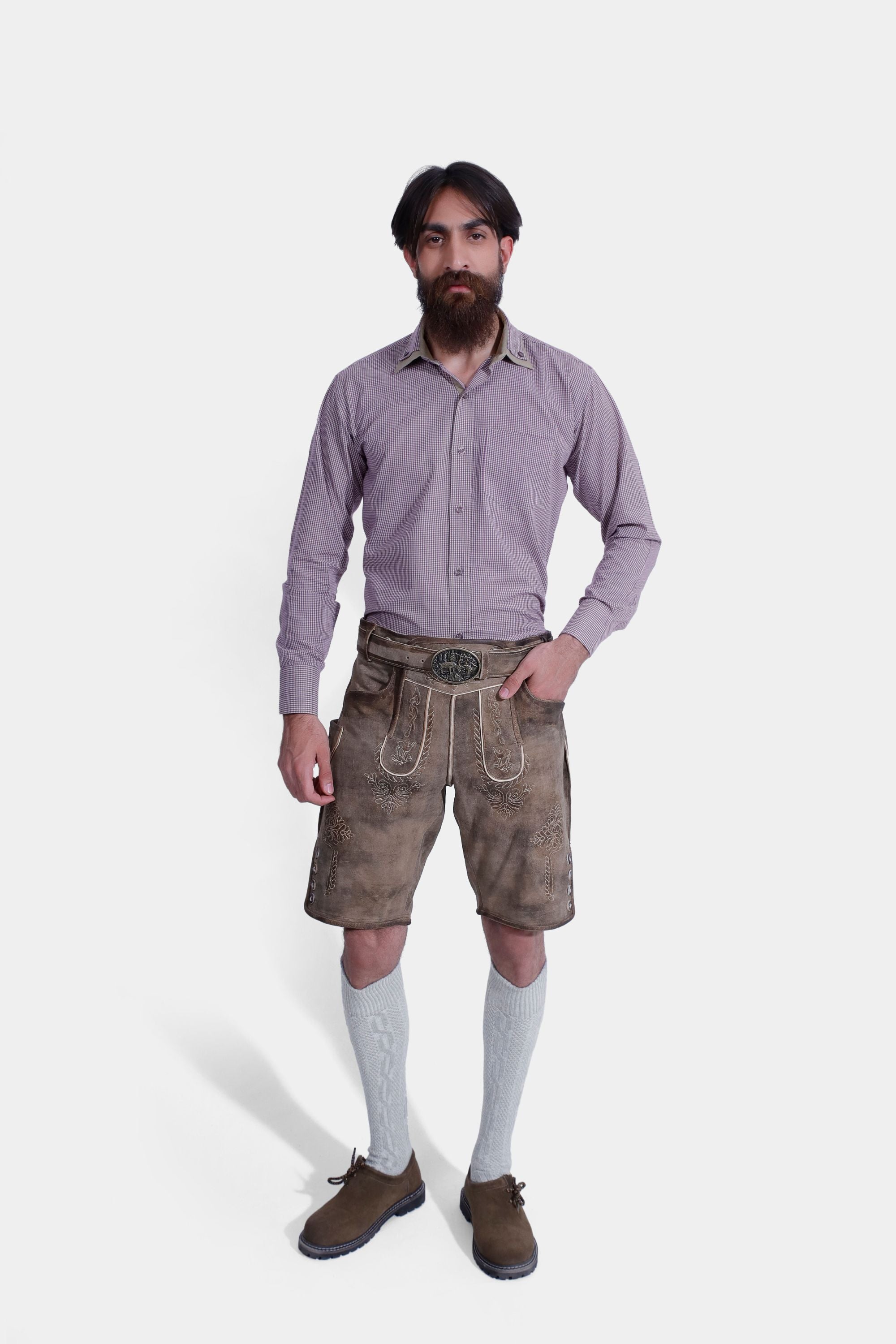 Complete front view of a Man wearing "Chiemsee Castle Elite Lederhosen" in Opal Mist with intricate embroidery, paired with a checkered shirt.