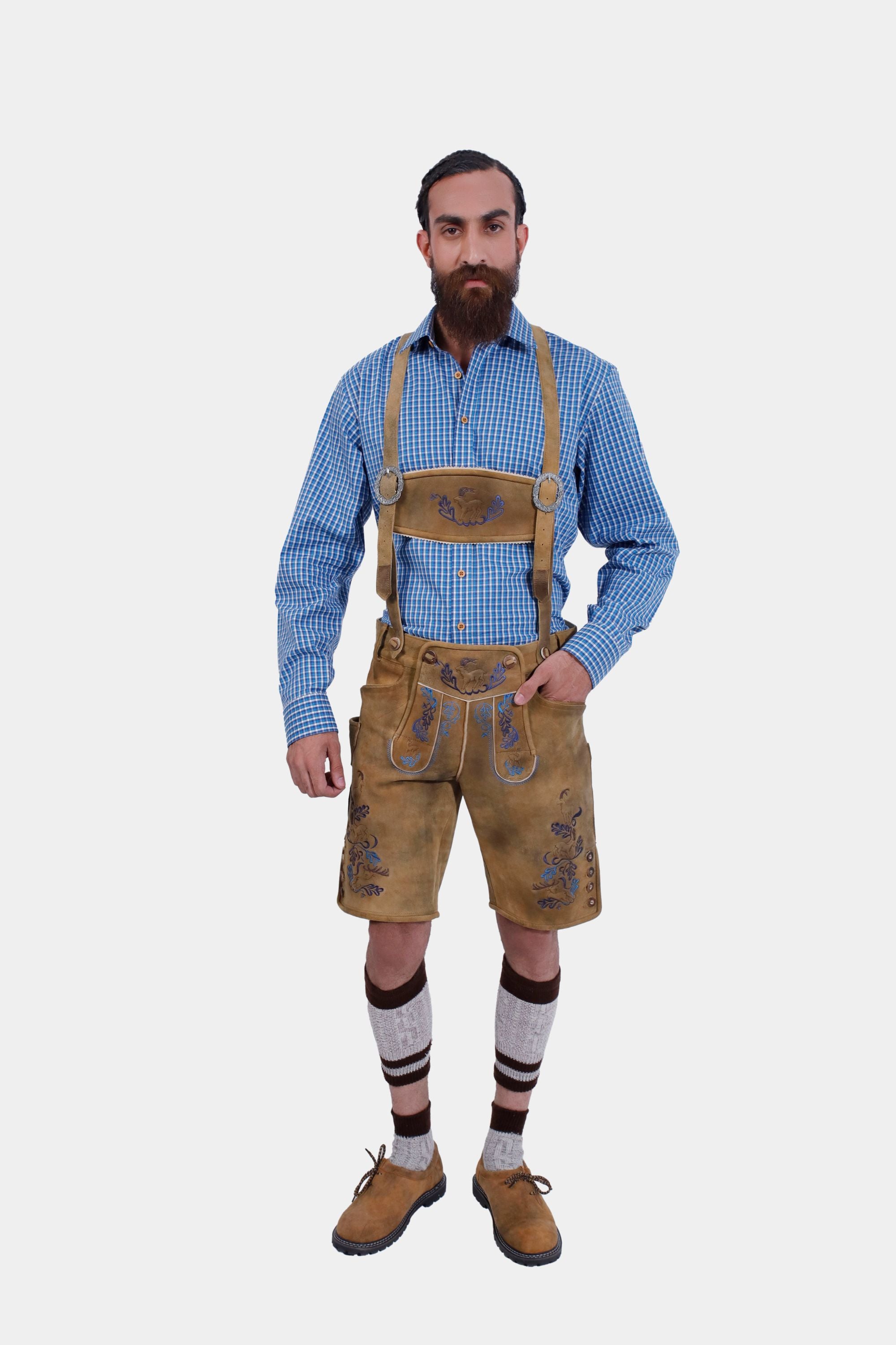Full-length image of a man in lederhosen, emphasizing the length and fit of the shorts and detailing on the suspenders.