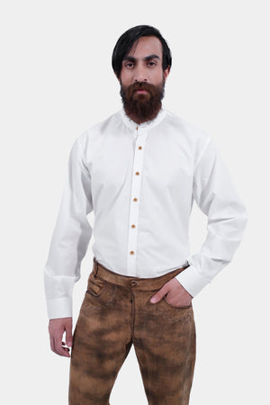 closed front view of a man wearing traditional lederhosen long pants with intricate embroidery paired with a plain white shirt
