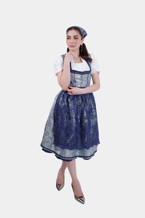 Full-length view of the Dirndl dress from the front, showing the detailed pattern and elegant design with matching high heels.