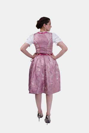 Back view of the pink dirndl, displaying the solid pink fabric of the bodice and skirt, with subtle seam details and a gathered waist