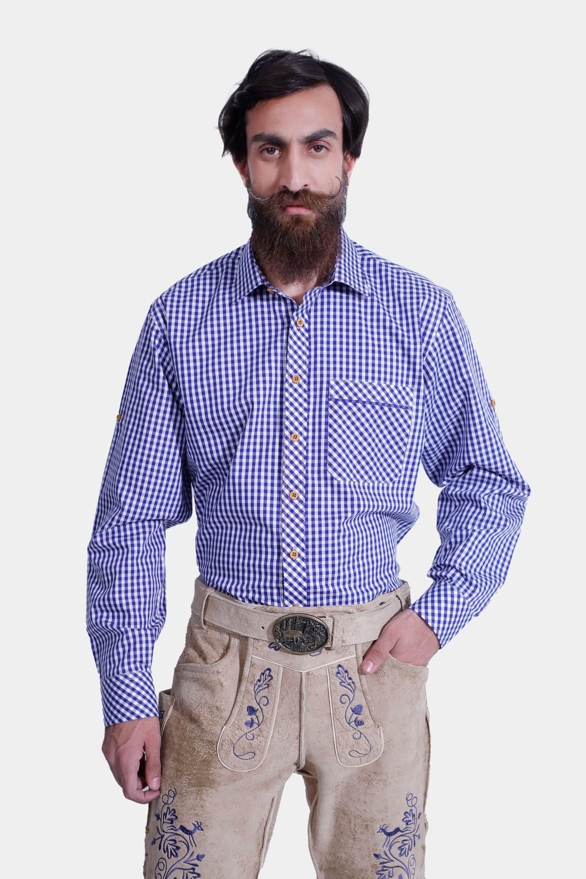 Closed view of a man in light beige lederhosen with blue embroidery, front and back pockets, and a side knife pocket