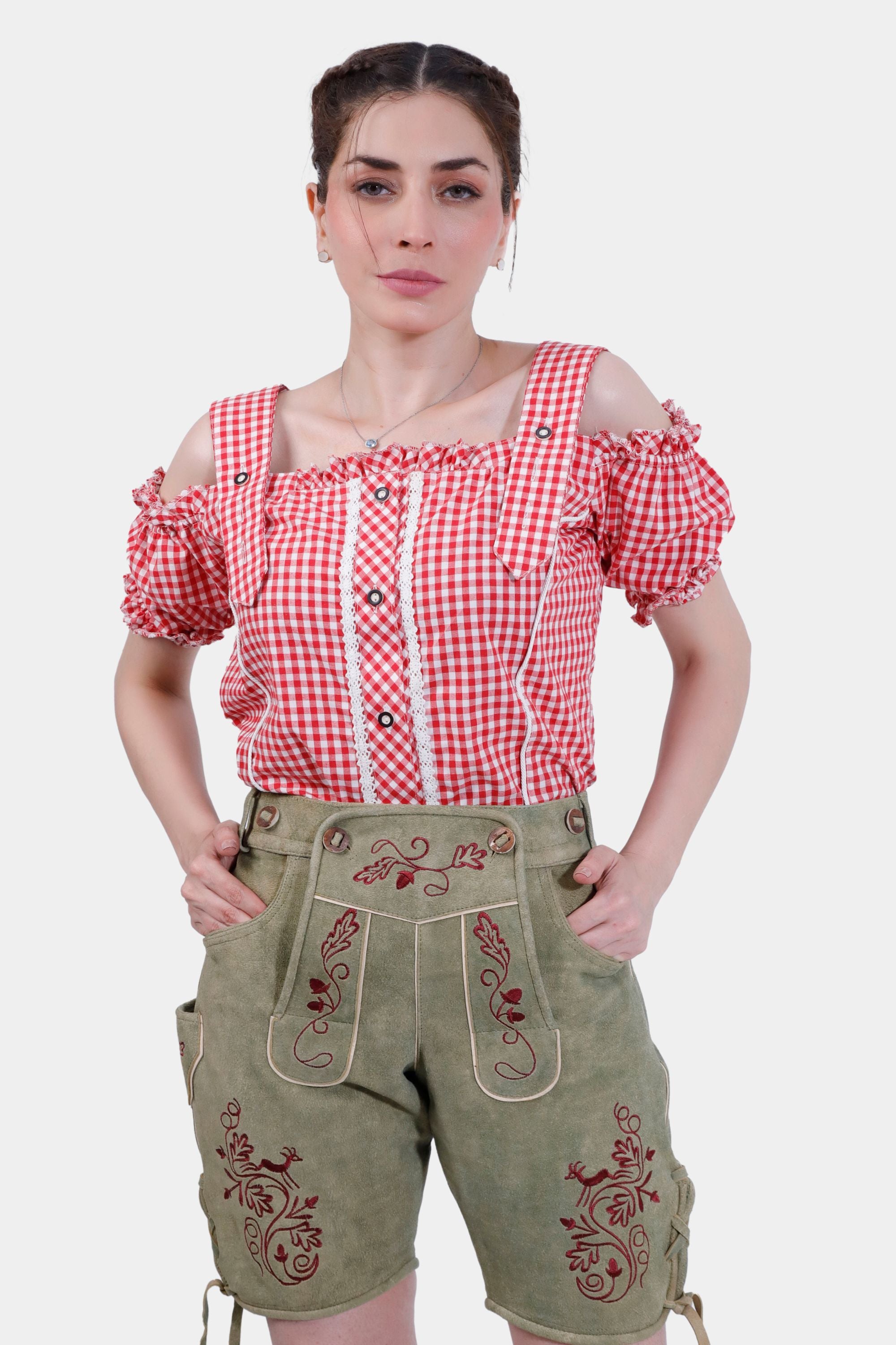 Woman wearing Halle Berry Lederhosen in Olivewood Leaf, paired with a red and white checkered blouse, front view.