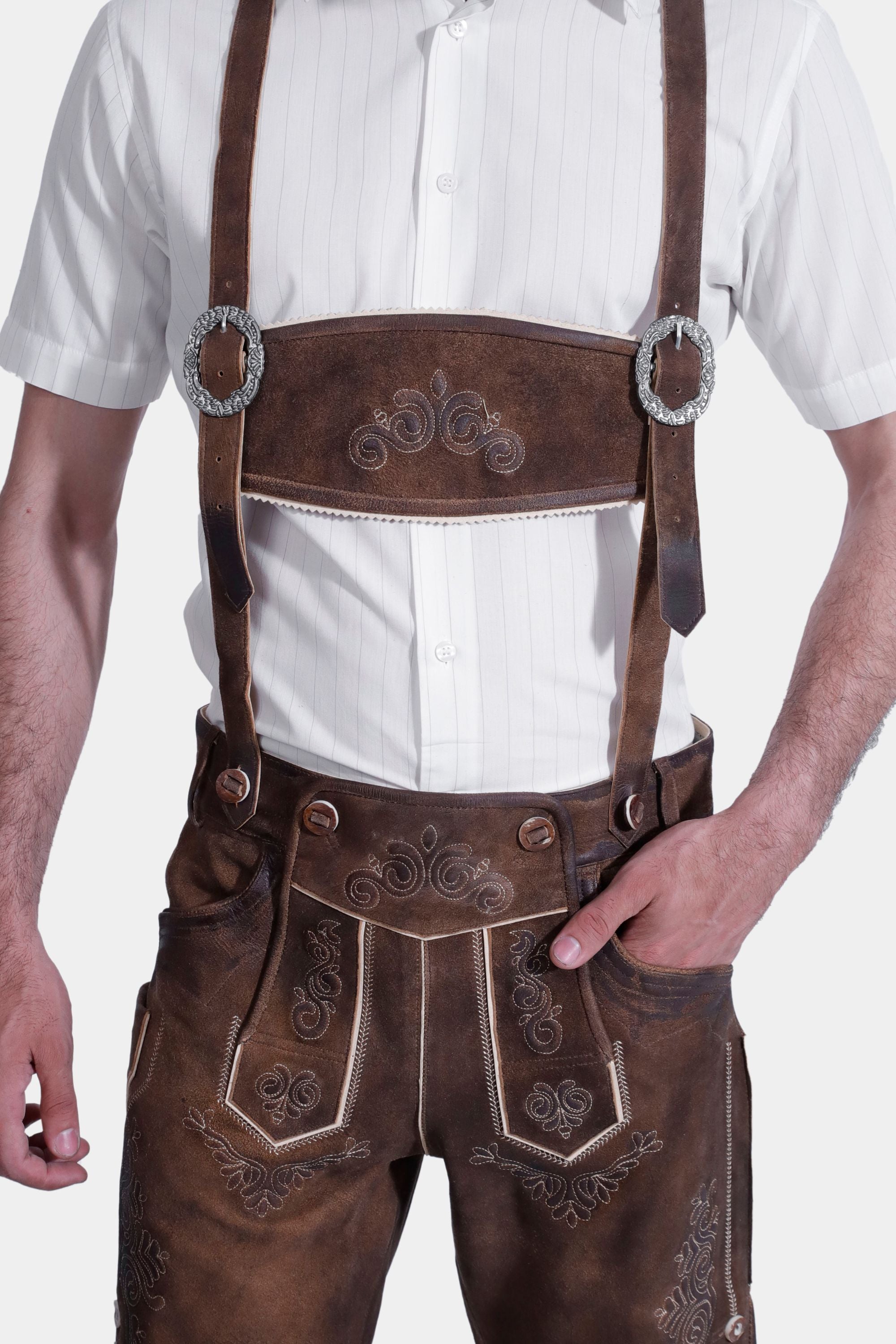 A close-up of the suspenders and embroidery on the brown leather lederhosen.