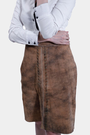Side close-up view of women wearing a traditional brown leather Karoline Lederhosen Skirt with subtle embroidery.