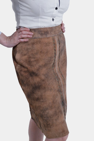 Close-up view of women wearing a traditional brown leather Karoline Lederhosen Skirt with subtle embroidery.