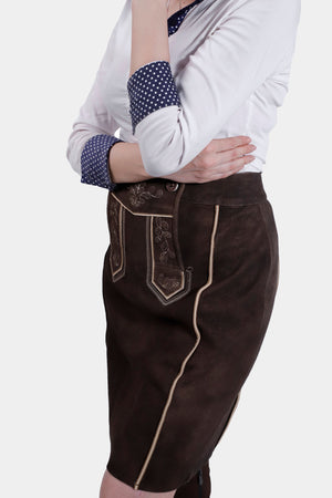 Side view of the Lillian Lederhosen Skirt showcasing intricate embroidery and goat suede texture.