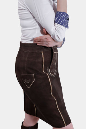 Close-up side view of the Lillian Lederhosen Skirt highlighting the natural color embroidery on the waistband.
