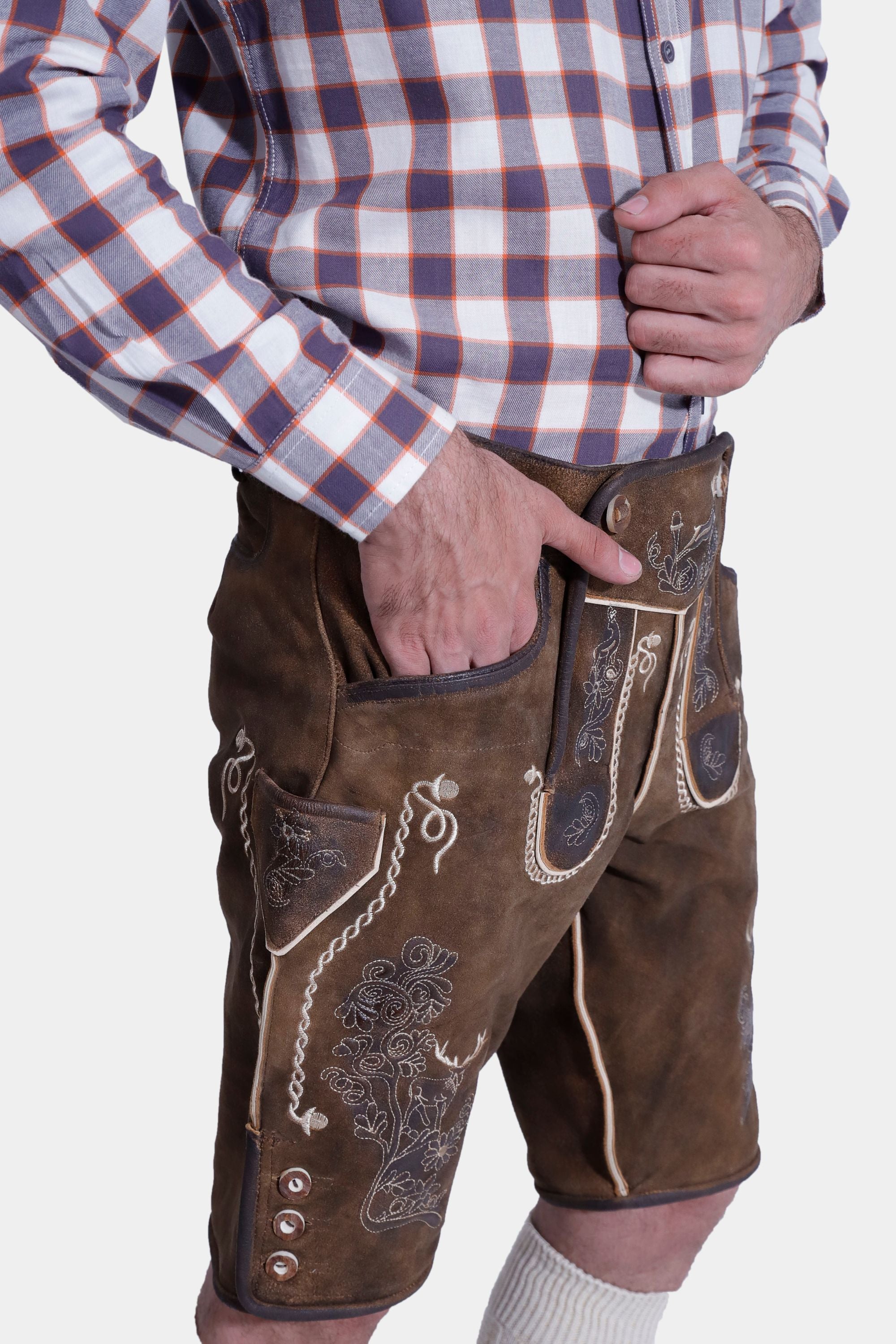closed side view of man in Rustic Maple Max Planck Lederhosen with intricate embroidery and versatile pockets.