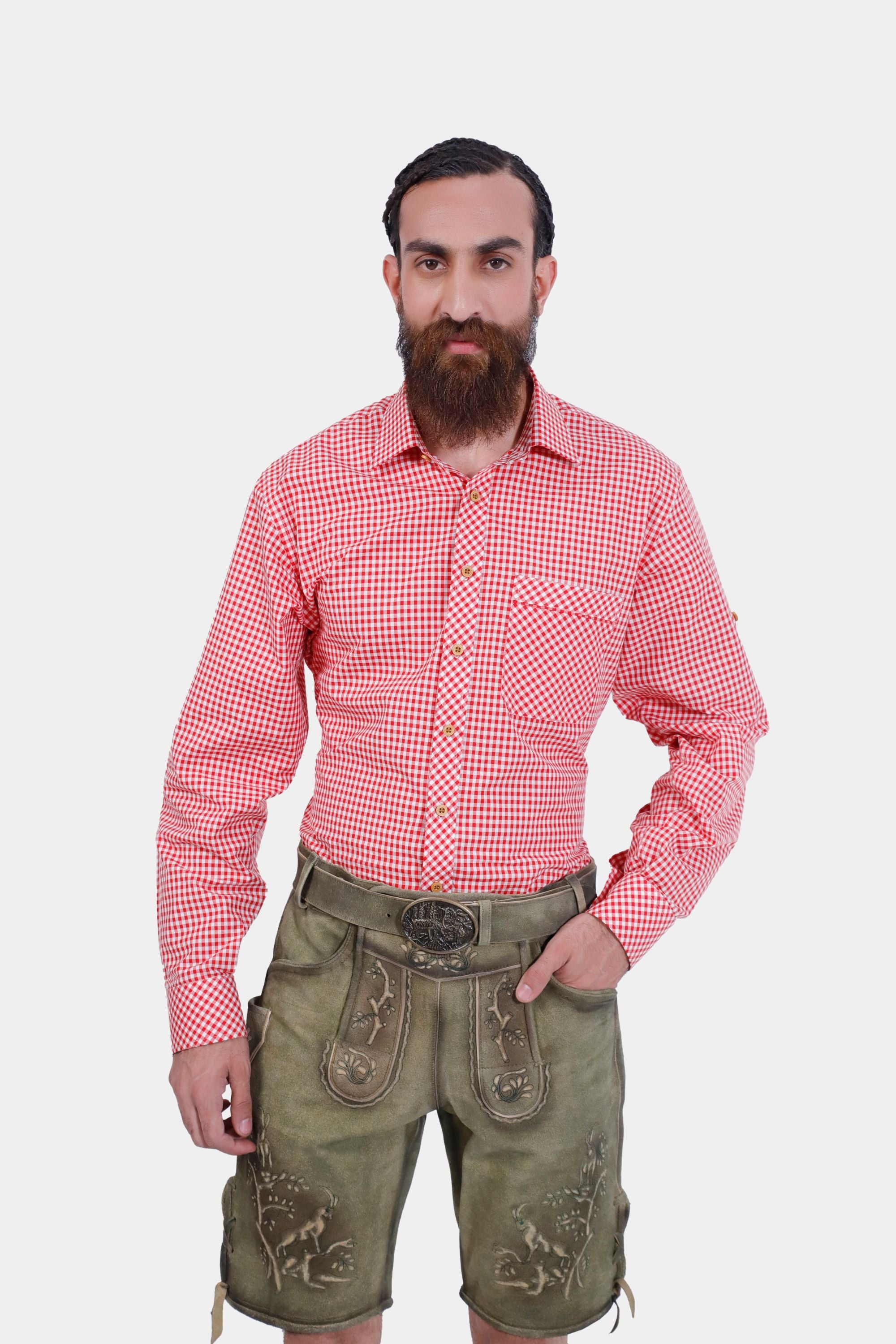 Close-up of traditional German lederhosen with detailed embroidery and red checkered shirt."