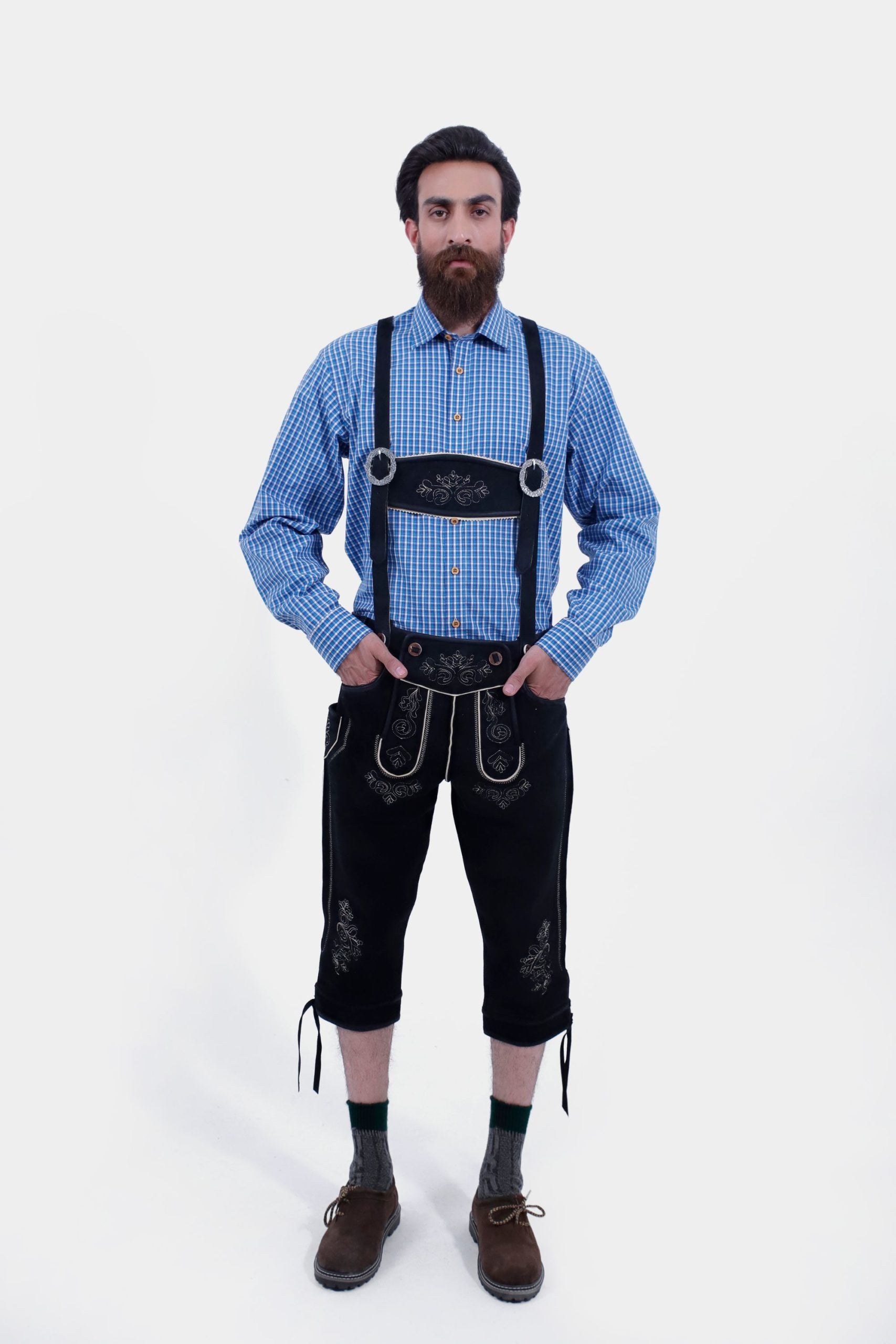 Man wearing Oktoberfest Elite German Lederhosen Suspender with a blue checkered shirt.