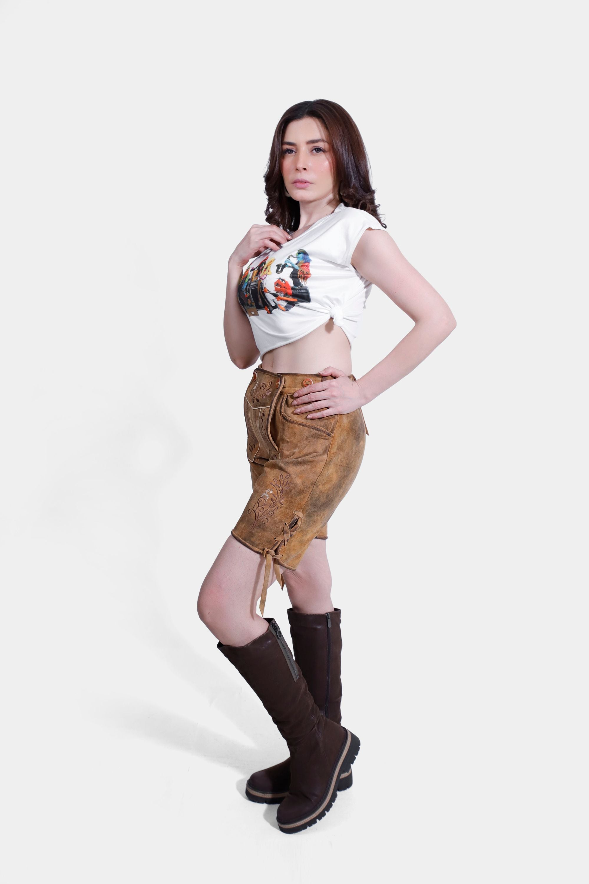 Another side of Royal Saxony Lederhosen in Golden Amber Delight, goatskin leather with natural embroidery, brown horn buttons, and multiple pockets