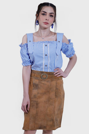 Model in Rustic Dream Lederhosen Skirt, Sunset Bronze goat suede, with blue gingham top.