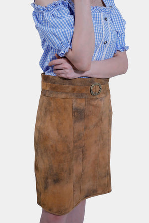 Model in Rustic Dream Lederhosen Skirt, Sunset Bronze goat suede, with blue gingham top.
