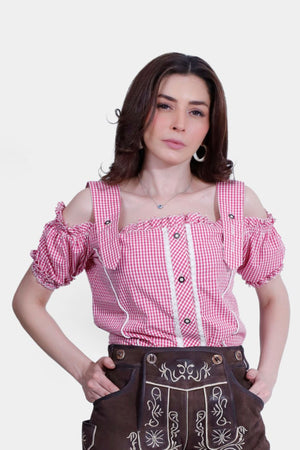 Woman wearing a red and white checkered Sarah Traditional Blouse, front view.