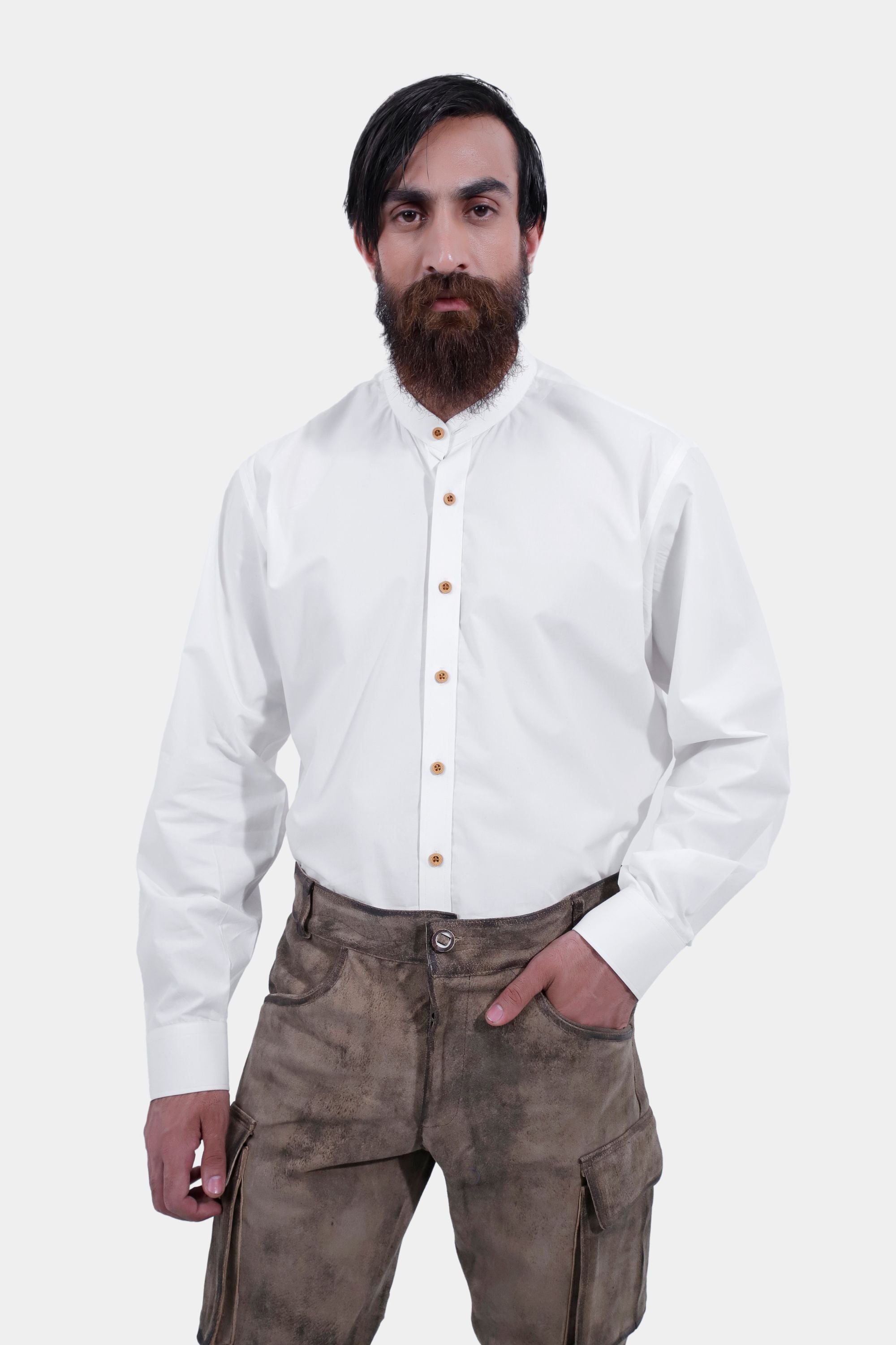closed front view of a man wearing stamberg cargo long lederhosen paired with plain white shirt