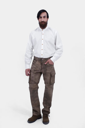 complete front view of a man wearing stamberg cargo long lederhosen paired with plain white shirt and dark brown shoes