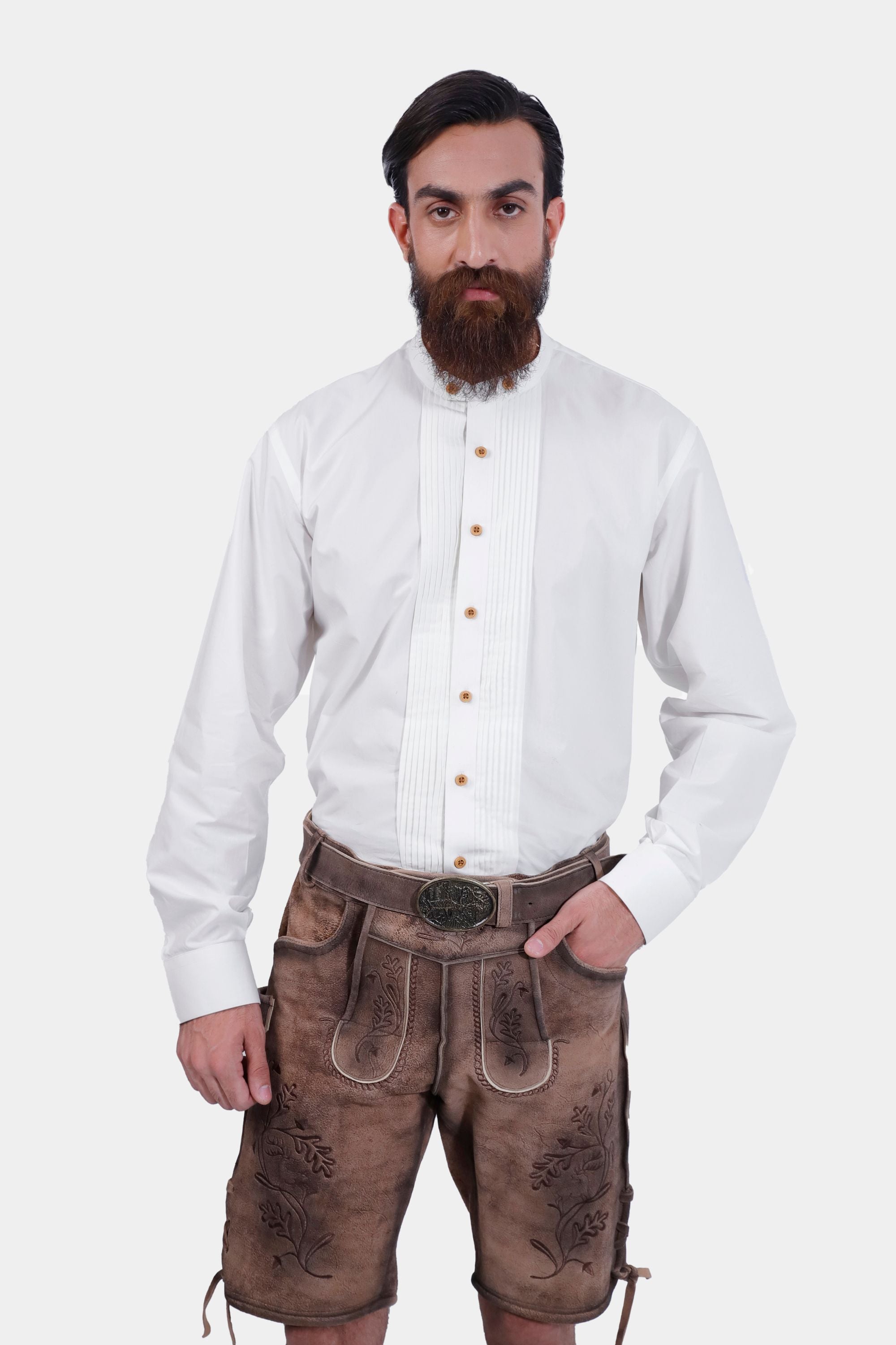 Closed front view of a man wearing Timber Trail Lederhosen in Caramel Earth with suspenders in natural embroidery, goat suede leather.