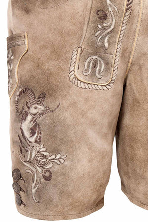 Side view of German short lederhosen with intricate goat embroidery and decorative buttons, embodying traditional German leather shorts craftsmanship