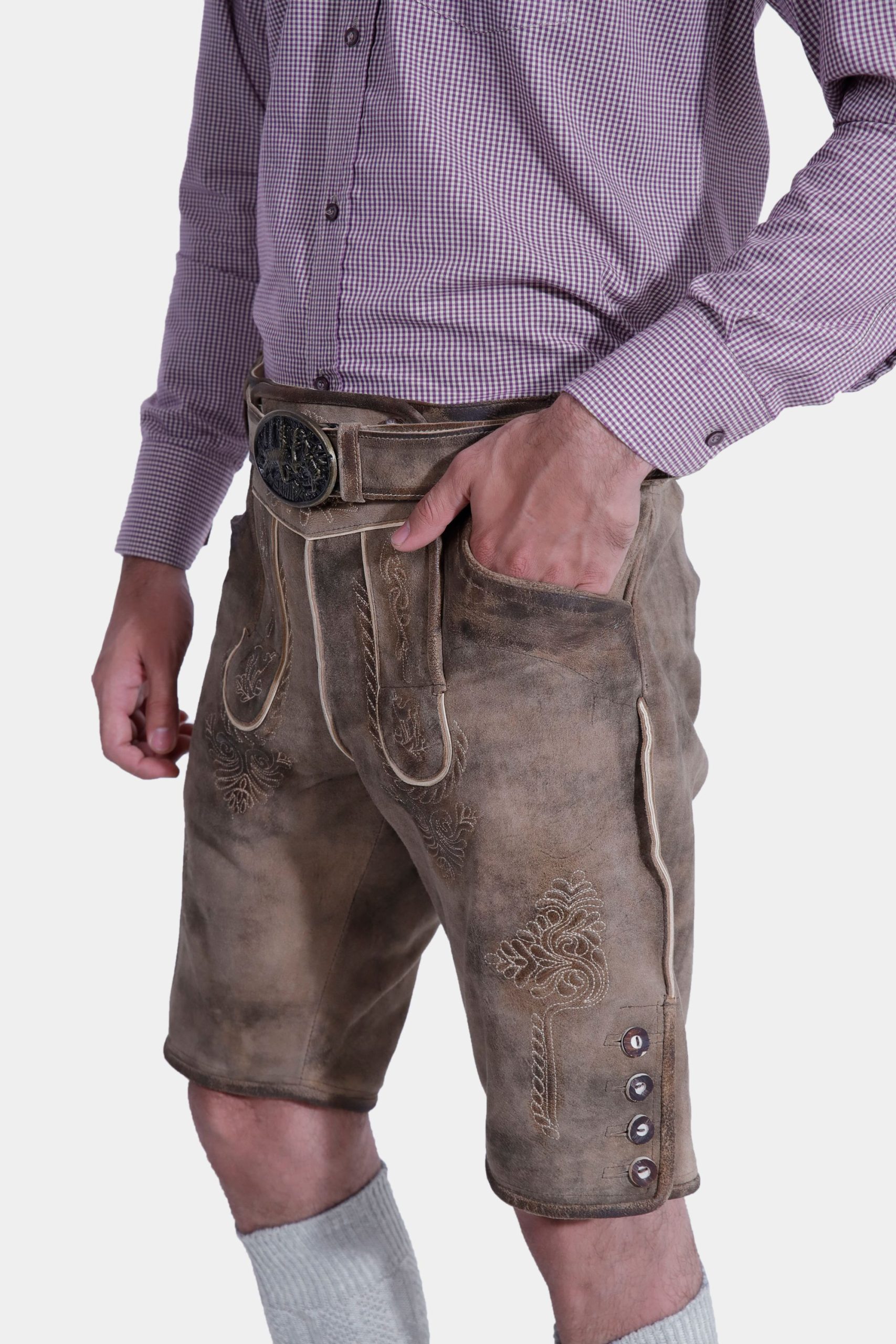 Closed side view of a Man wearing "Chiemsee Castle Elite Lederhosen" in Opal Mist with intricate embroidery, paired with a checkered shirt.