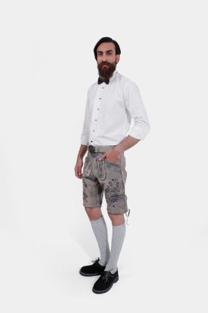 Man modeling Staffelsee Sunset Lederhosen, highlighting the knee-length fit and traditional Bavarian design
