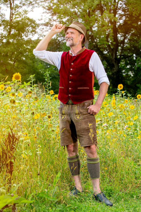 A Bavarian man wearing traditional lederhosen costume.