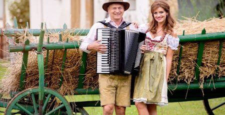 Bavarian couple sing a Oktoberfest songs