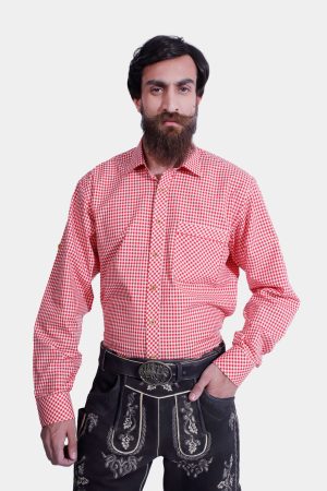 closed view of a man wearing black Lahm Lederhosen with detailed white embroidery, paired with a red checkered shirt.