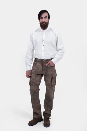 complete front view of a man wearing stamberg cargo long lederhosen paired with plain white shirt and dark brown shoes
