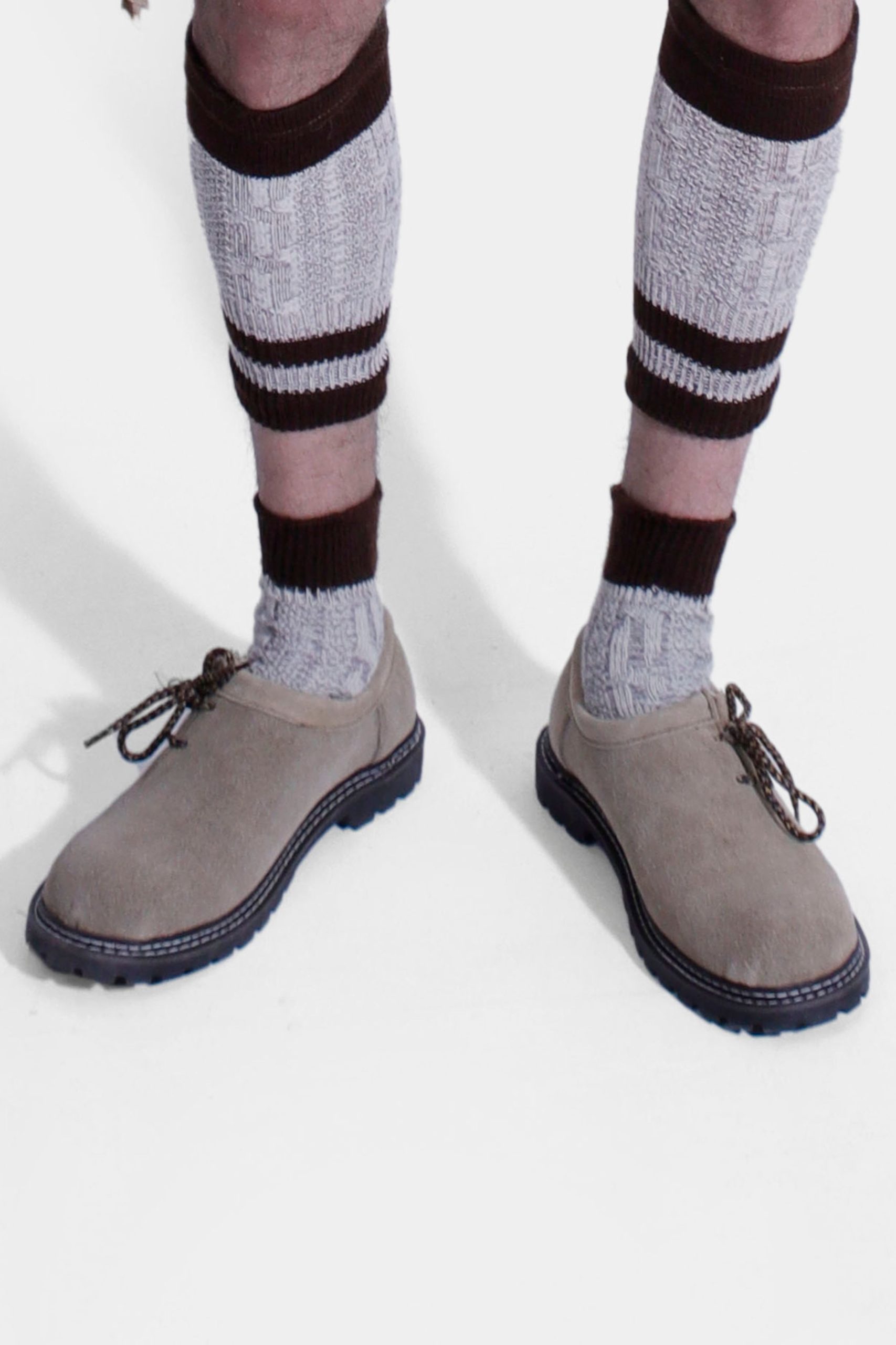 Antonio Bavarian Shoes in soft beige, shown with traditional Bavarian socks. Features a sleek, slip-resistant design with a cushioned leather insole for comfort. Perfect for pairing with Lederhosen or jeans.