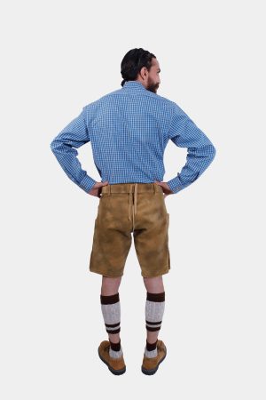 Full-length back view of a man in traditional lederhosen, highlighting the adjustable back waistband and overall fit.