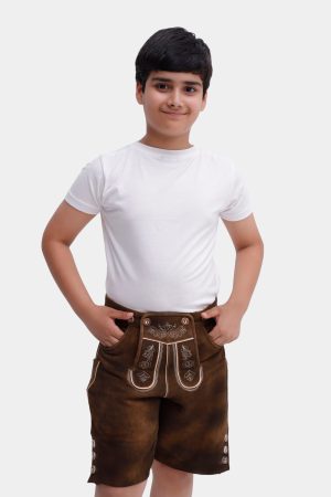Full body portrait of a young boy dressed in white T-shirt and Elias Lederhosen with elegant embroidery, standing with a slight smile
